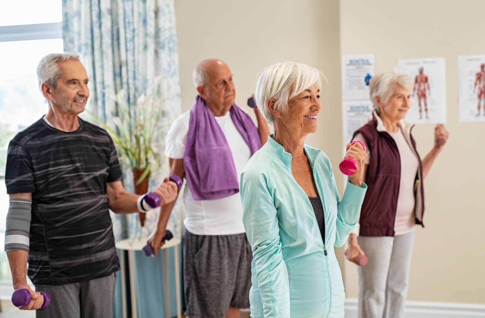 A group of seniors attend an exercise class at their independent living community.